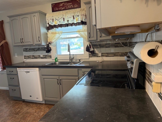 302 West Ward Street Energy, IL 62933 - Photo 10 of 37 a kitchen with kitchen island granite countertop a sink and a stove