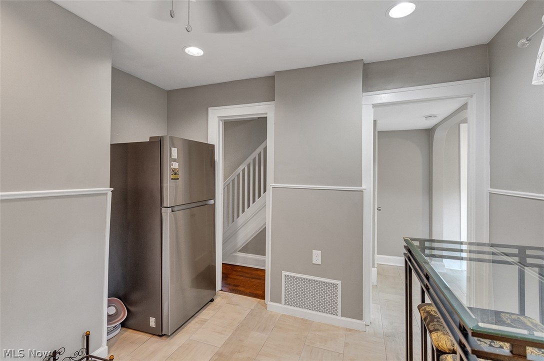 2972 Yorkshire Road Cleveland Heights, OH 44118 - Photo 14 of 44 Light-toned tile flooring complements neutral wall tones with white chair rail molding