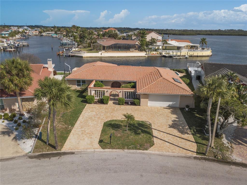 4964 South Shore Drive New Port Richey, FL 34652 - Photo 1 of 69 an aerial view of a house with a yard and lake view