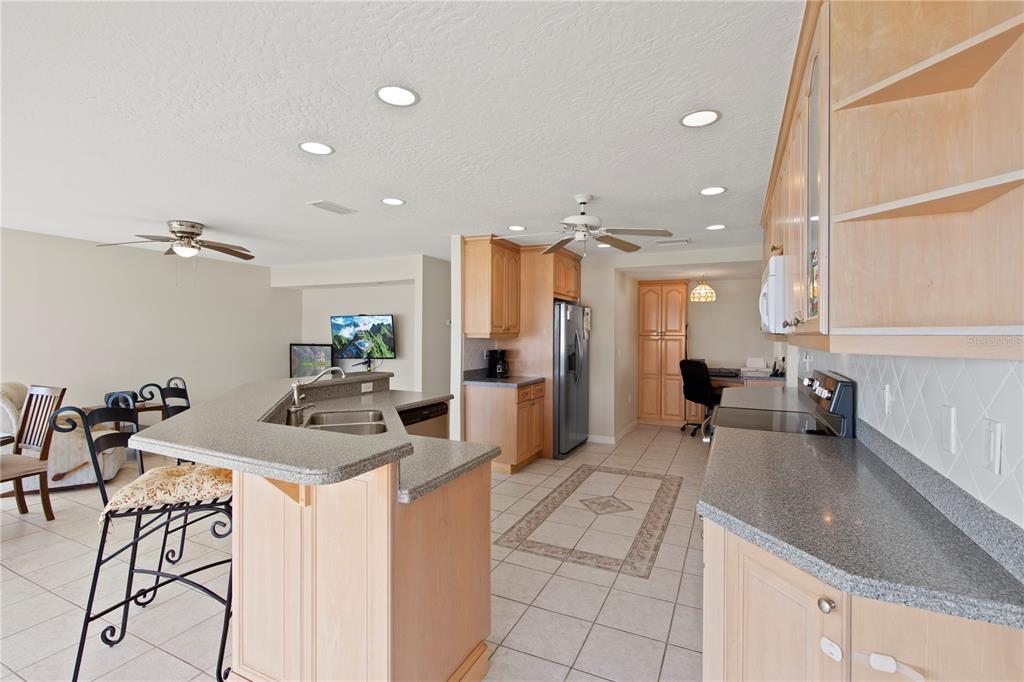 4964 South Shore Drive New Port Richey, FL 34652 - Photo 13 of 69 a kitchen with a sink appliances and cabinets