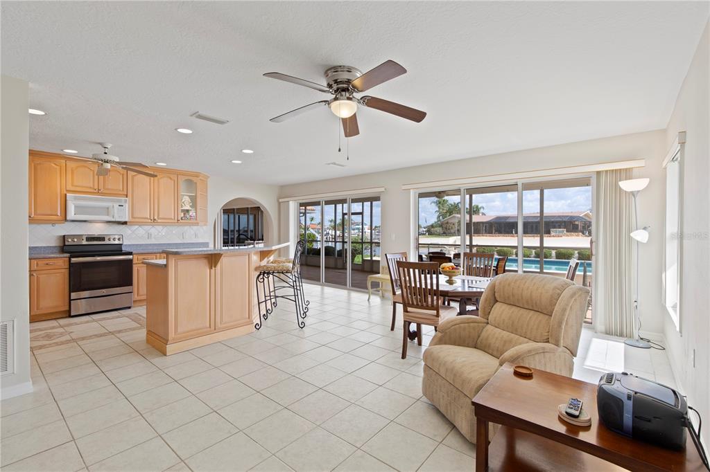 4964 South Shore Drive New Port Richey, FL 34652 - Photo 17 of 69 a living room with furniture and kitchen view