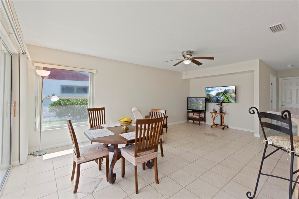 4964 South Shore Drive New Port Richey, FL 34652 - Photo 18 of 69 a view of a dining room with furniture