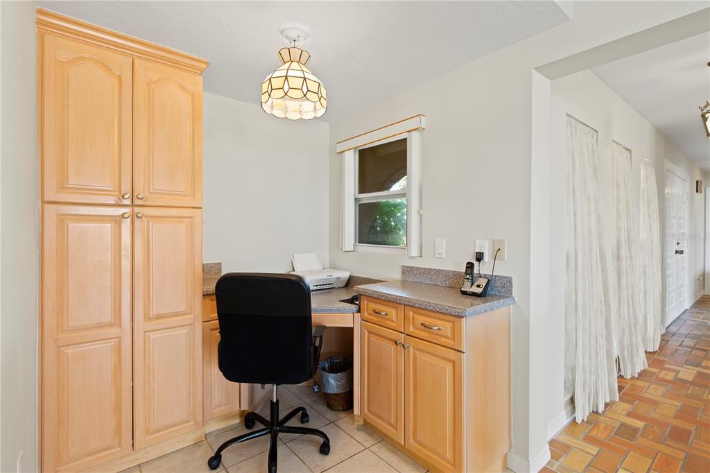 4964 South Shore Drive New Port Richey, FL 34652 - Photo 21 of 69 a view of a workspace with furniture and a window