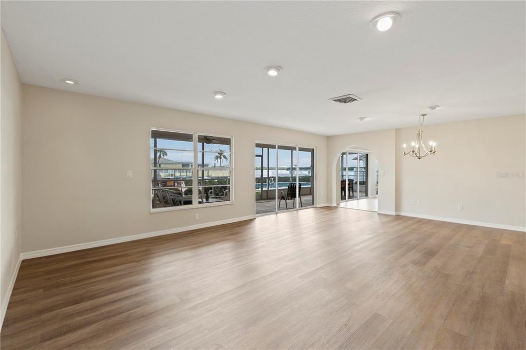 4964 South Shore Drive New Port Richey, FL 34652 - Photo 24 of 69 a view of an empty room with wooden floor and a window