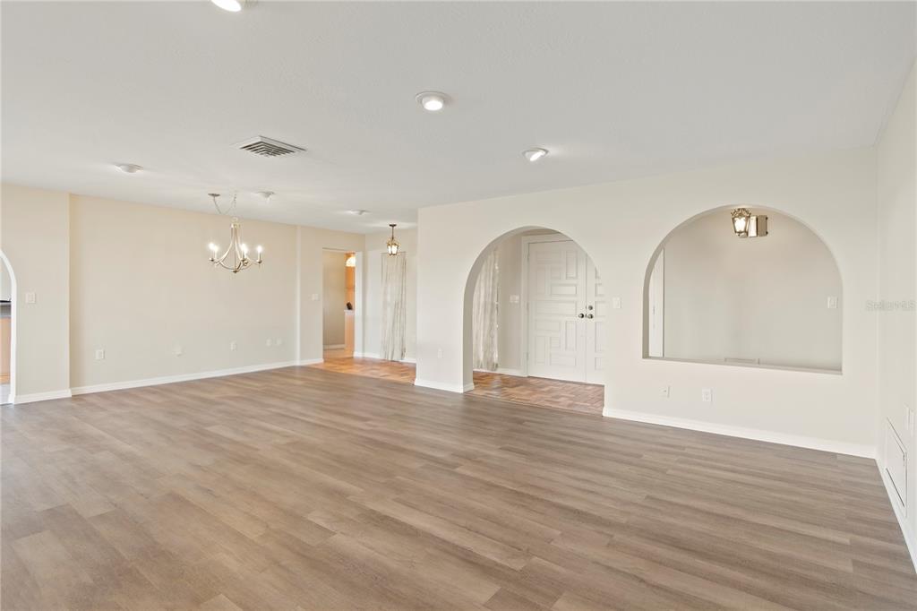 4964 South Shore Drive New Port Richey, FL 34652 - Photo 25 of 69 a view of an empty room with wooden floor