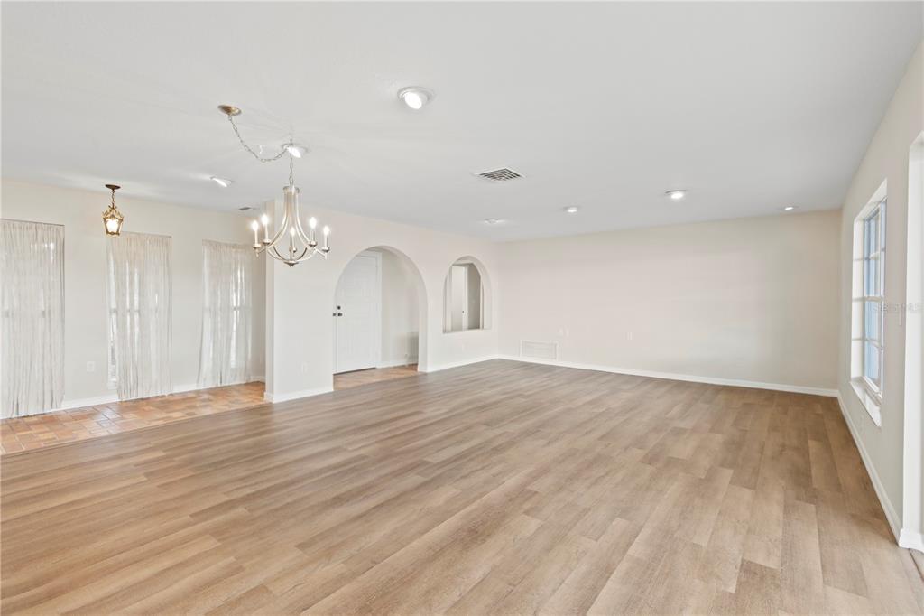 4964 South Shore Drive New Port Richey, FL 34652 - Photo 26 of 69 a view of an empty room with wooden floor and a window