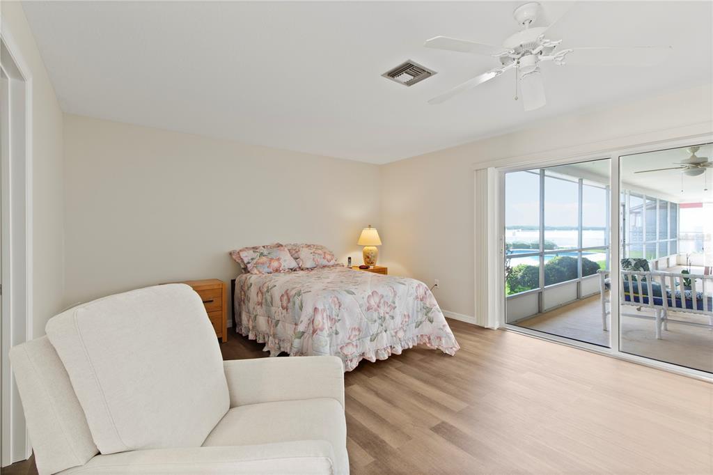 4964 South Shore Drive New Port Richey, FL 34652 - Photo 29 of 69 a bedroom with a bed and a couch
