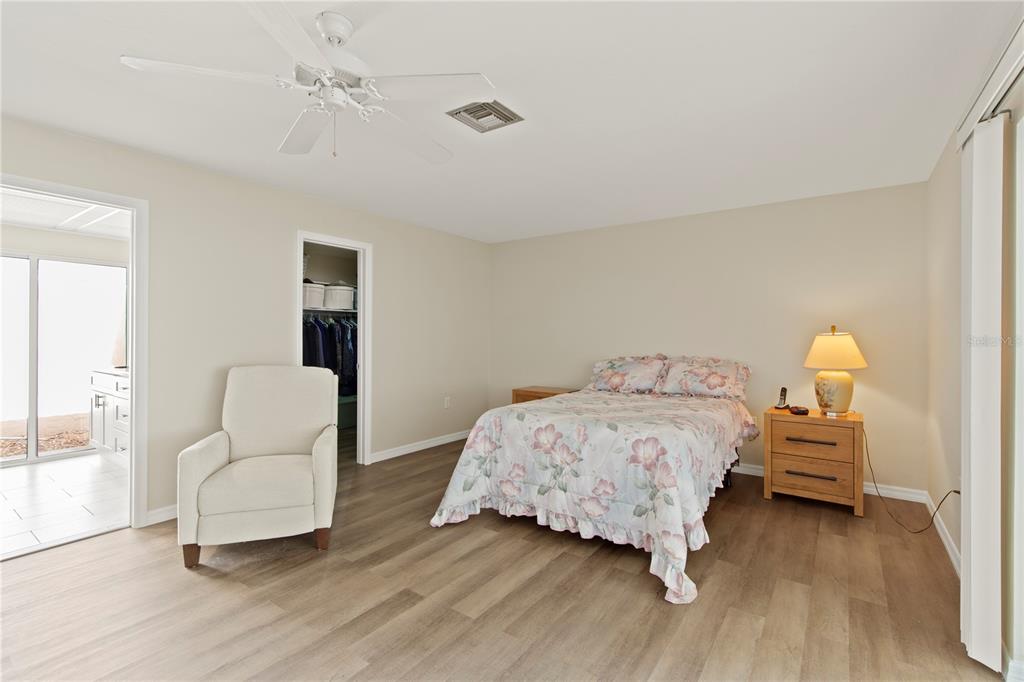 4964 South Shore Drive New Port Richey, FL 34652 - Photo 30 of 69 a bedroom with a bed and a couch