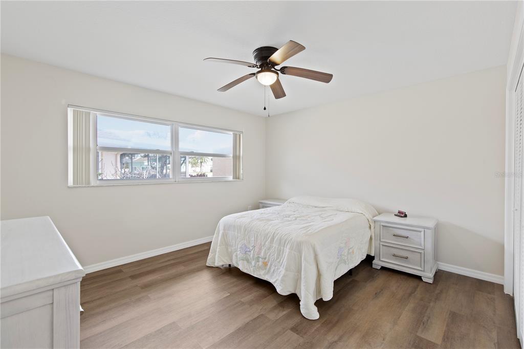 4964 South Shore Drive New Port Richey, FL 34652 - Photo 34 of 69 a bedroom with a bed and a window