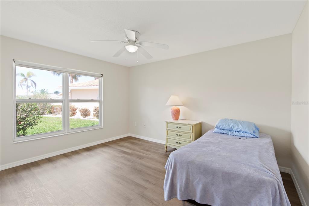 4964 South Shore Drive New Port Richey, FL 34652 - Photo 36 of 69 a bedroom with a bed and a window