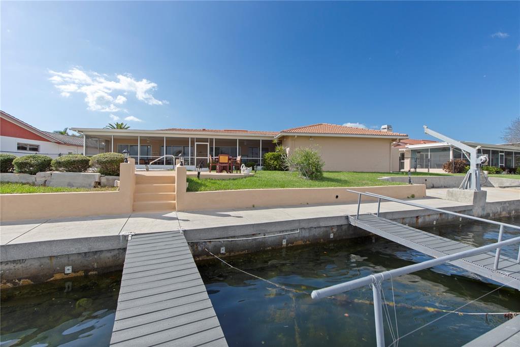 4964 South Shore Drive New Port Richey, FL 34652 - Photo 52 of 69 a view of a swimming pool with a patio