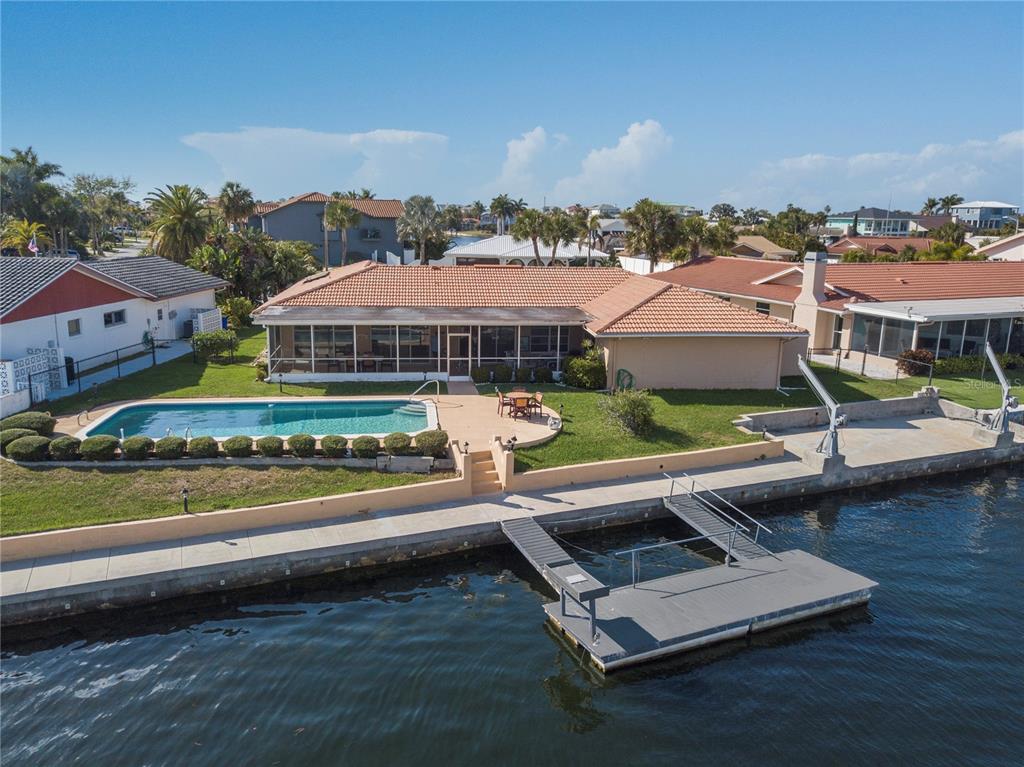 4964 South Shore Drive New Port Richey, FL 34652 - Photo 56 of 69 an aerial view of residential houses with outdoor space and ocean view