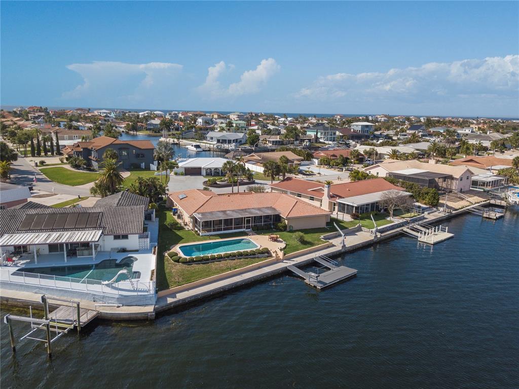 4964 South Shore Drive New Port Richey, FL 34652 - Photo 59 of 69 an aerial view of residential houses with outdoor space and ocean view