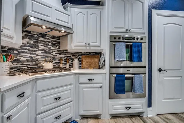 a bathroom with a granite countertop sink mirror and vanity
