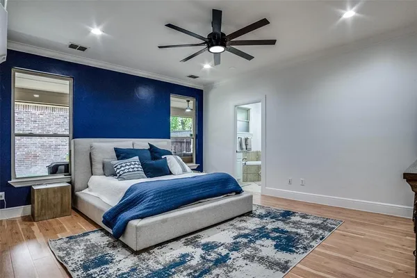 a bedroom with a bed and a tv