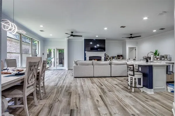 a living room with furniture fireplace and flat screen tv