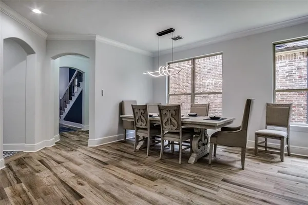a kitchen with stainless steel appliances granite countertop a stove and a refrigerator