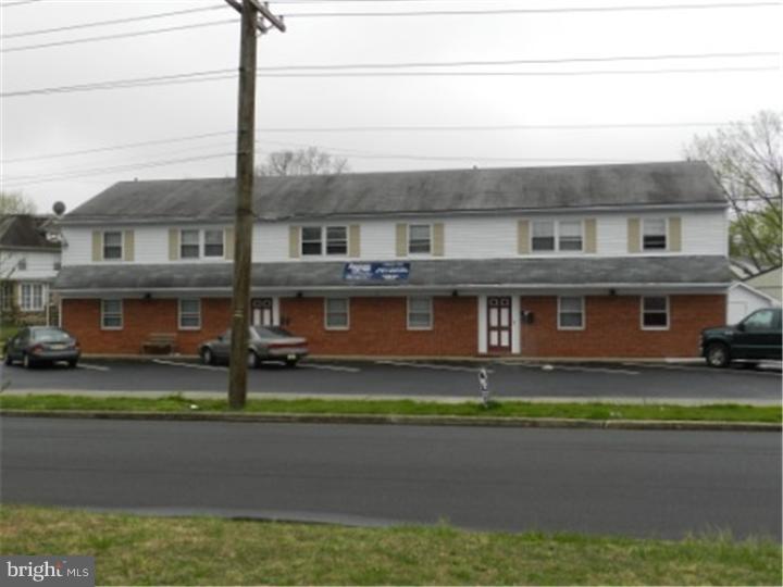 14 Girard Road South Glassboro, NJ 08028 - Photo 2 of 25 a front view of a house with a garden and yard