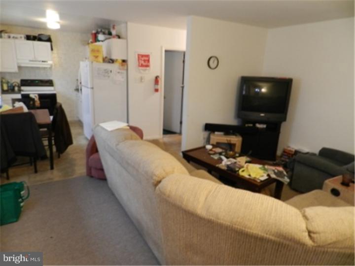 14 Girard Road South Glassboro, NJ 08028 - Photo 17 of 25 a bedroom with a bed and a couch