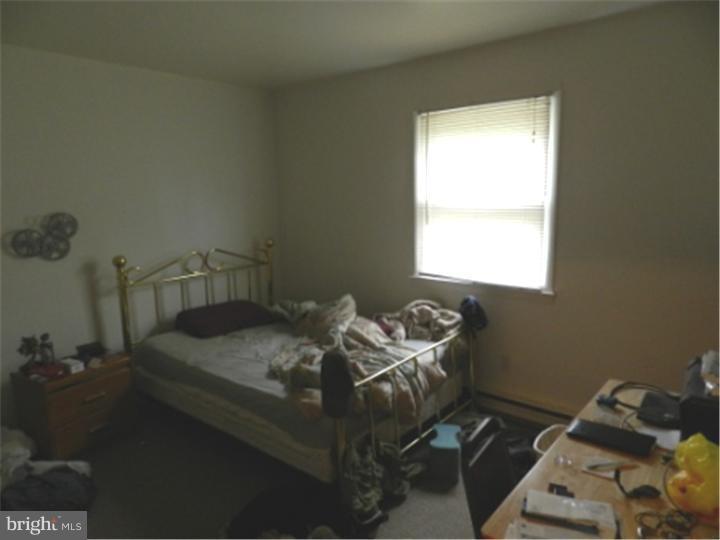 14 Girard Road South Glassboro, NJ 08028 - Photo 19 of 25 a bed sitting in a bedroom next to a window