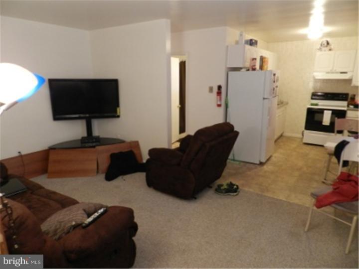 14 Girard Road South Glassboro, NJ 08028 - Photo 3 of 25 a living room with furniture and a flat screen tv