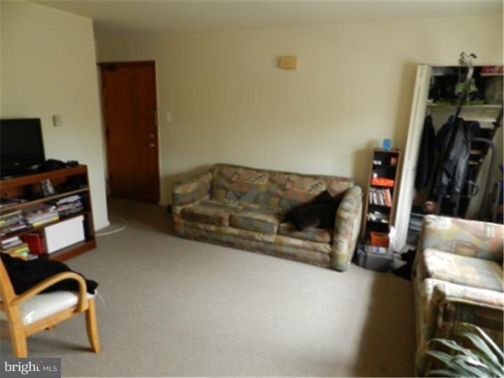 14 Girard Road South Glassboro, NJ 08028 - Photo 21 of 25 a living room with furniture and a flat screen tv