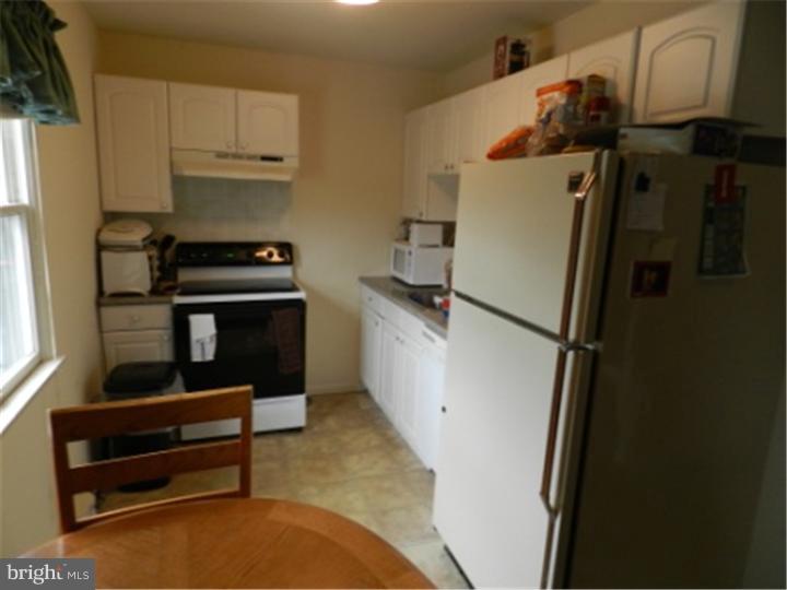 14 Girard Road South Glassboro, NJ 08028 - Photo 22 of 25 a kitchen with appliances a sink and cabinets