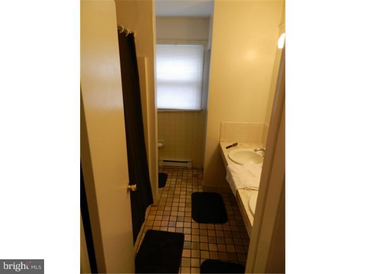 14 Girard Road South Glassboro, NJ 08028 - Photo 4 of 25 a bathroom with a sink and a mirror