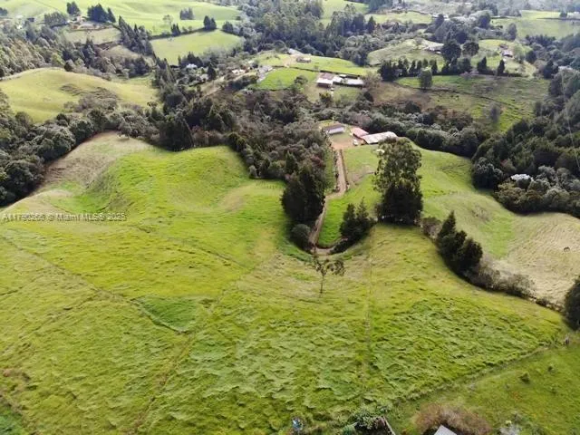 an aerial view of residential house with outdoor space