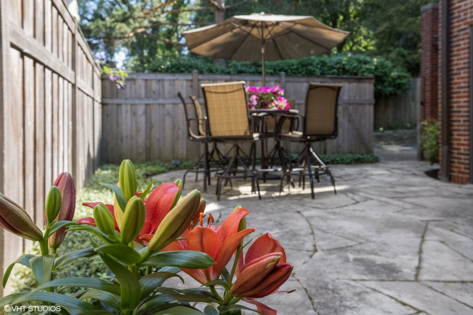 708 Kent Road Kenilworth, IL 60043 - Photo 40 of 42 a patio with tables and chairs potted plants