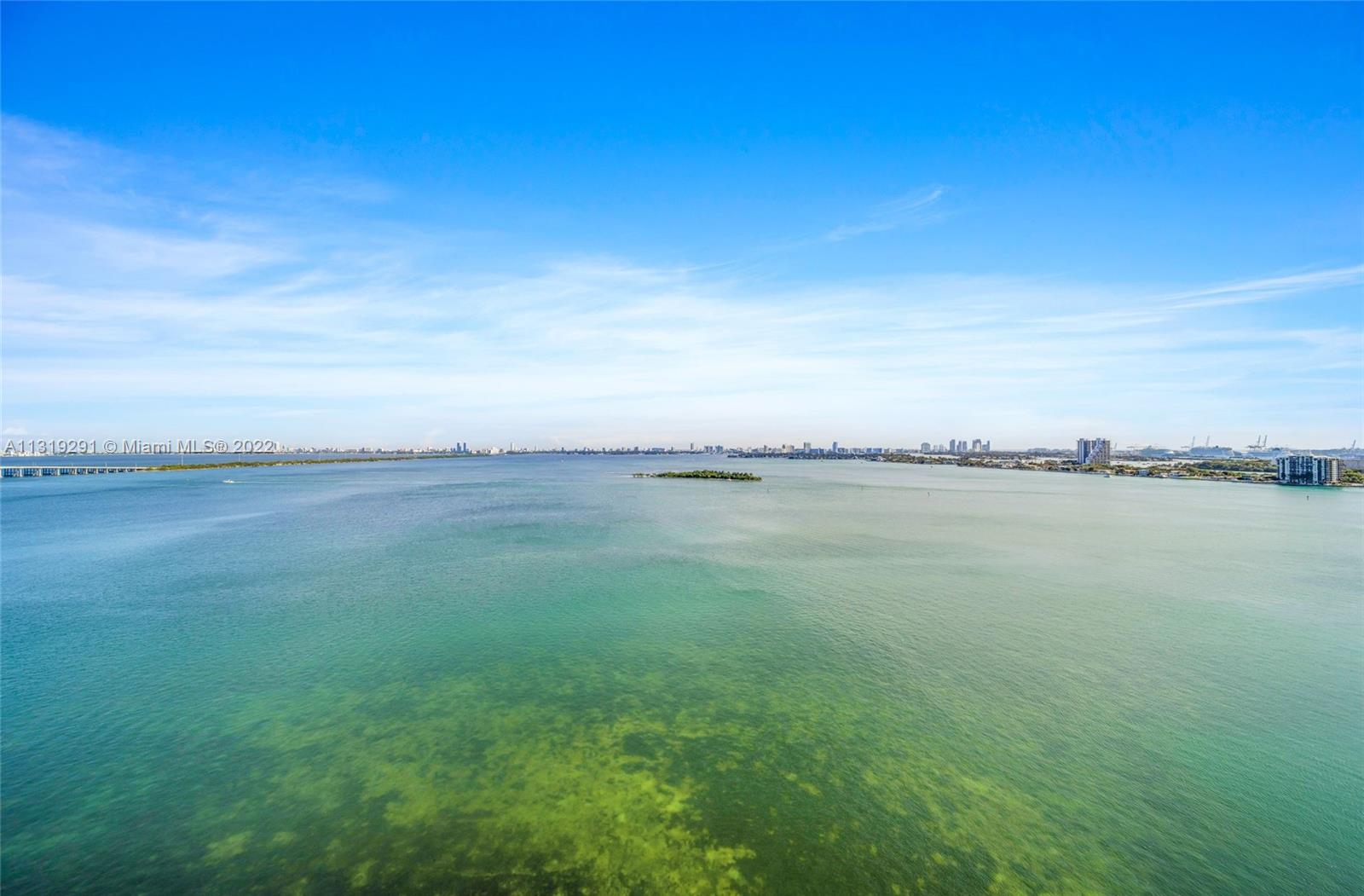 Edgewater Miami, FL 33137 - Photo 21 of 23 a view of a lake with a big yard