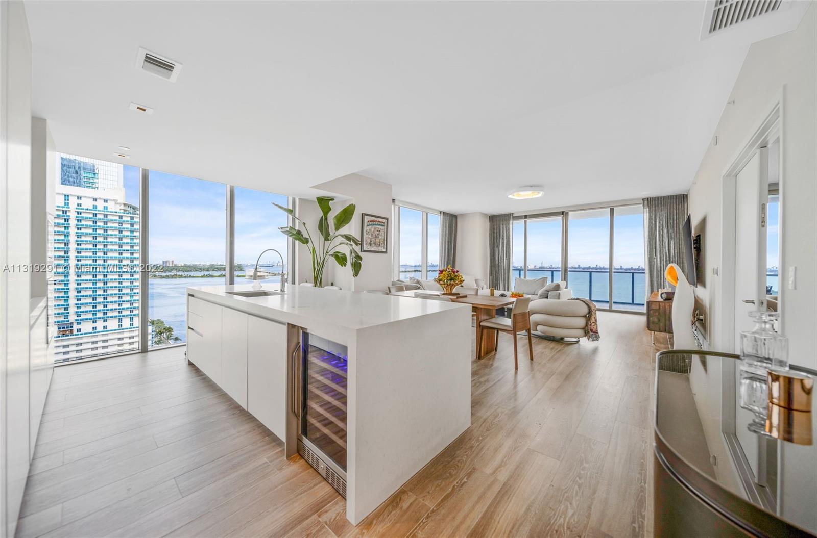 Edgewater Miami, FL 33137 - Photo 8 of 23 a living room with stainless steel appliances granite countertop furniture and wooden floors