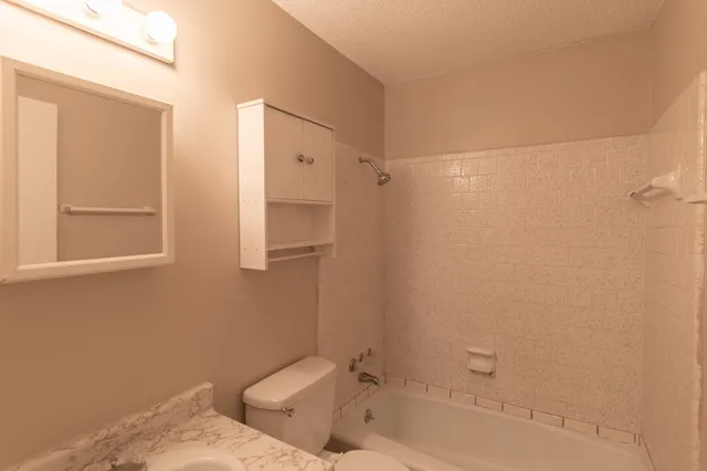 a bathroom with a bathtub and shower