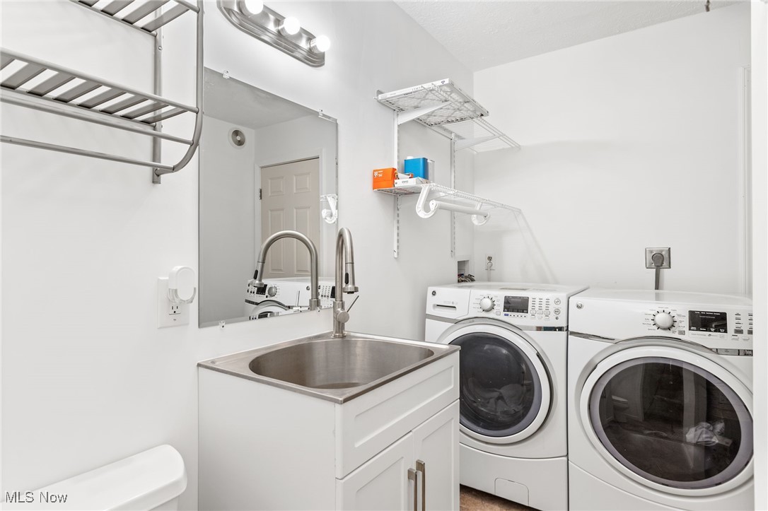 1418 Arcadia Road Kent, OH 44240 - Photo 19 of 27 Washroom featuring a sink and washer and dryer