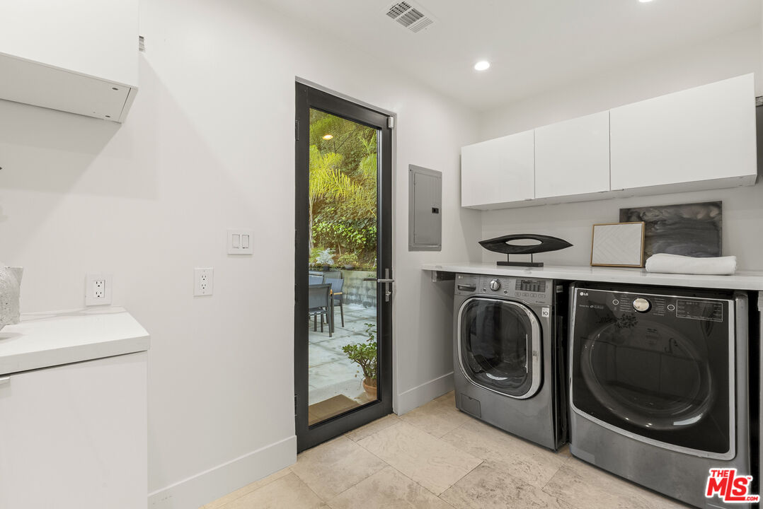 9782 Oak Pass Road Beverly Hills, CA 90210 - Photo 21 of 27 a utility room with dryer and washer