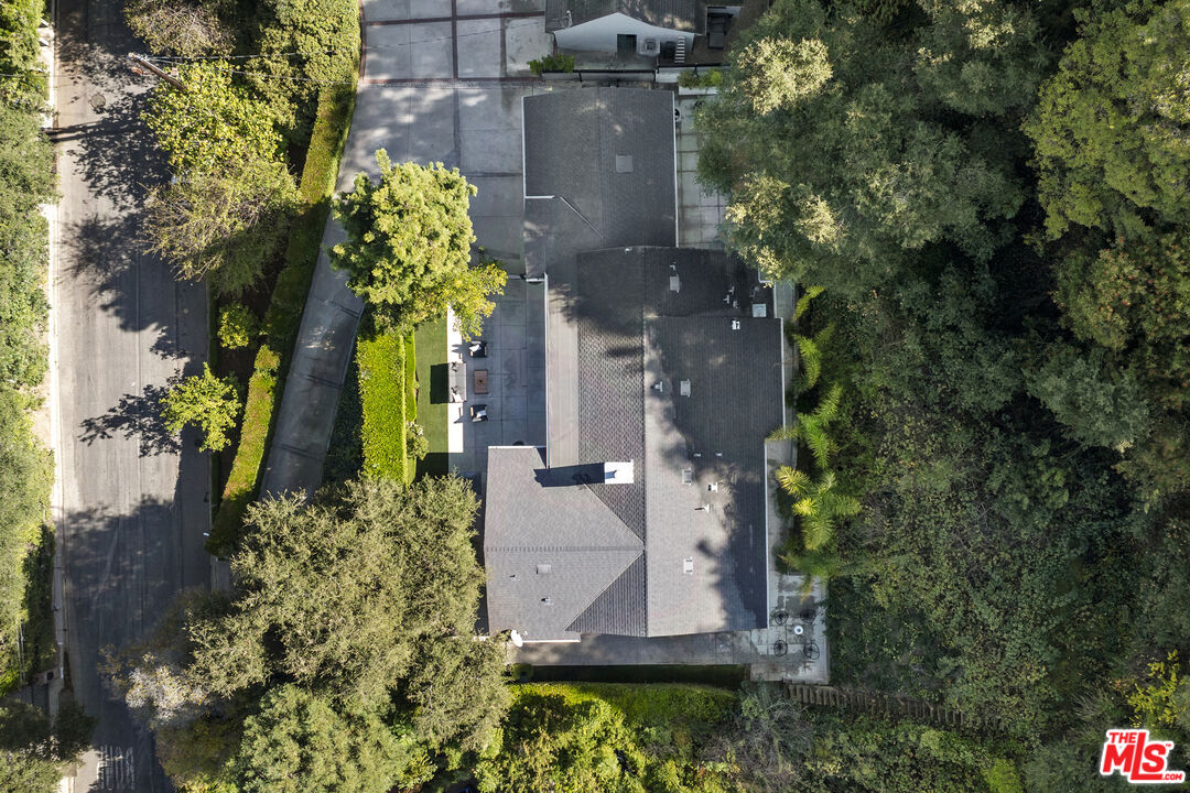 9782 Oak Pass Road Beverly Hills, CA 90210 - Photo 26 of 27 an aerial view of a house with a yard and garden