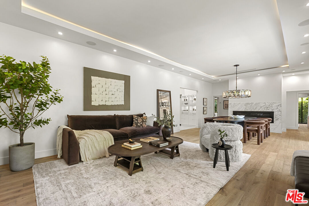 9782 Oak Pass Road Beverly Hills, CA 90210 - Photo 4 of 27 a living room with furniture kitchen view and a table
