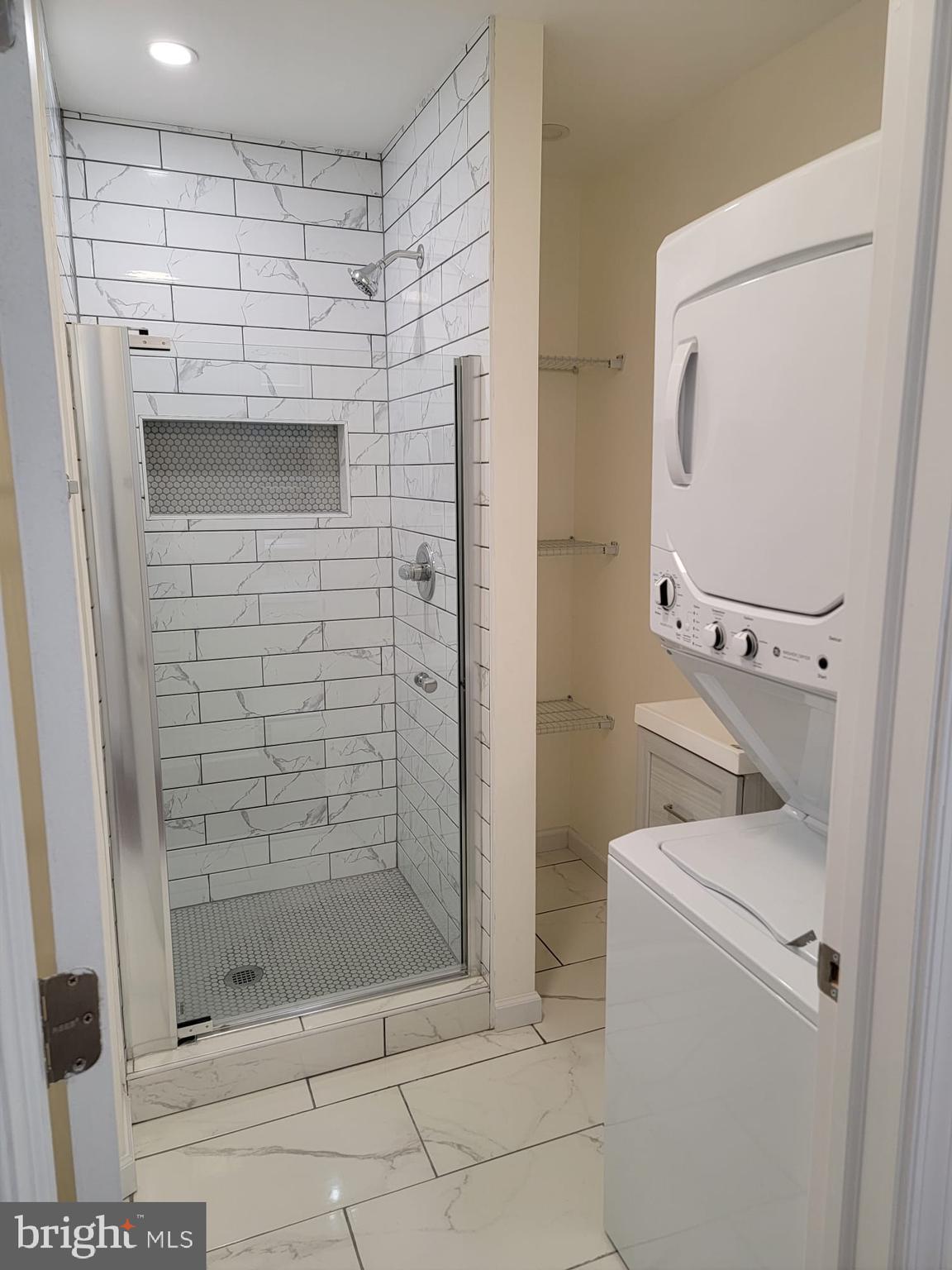 616 Tasker Street, Unit 2 Philadelphia, PA 19148 - Photo 17 of 22 a bathroom with a shower and toilet
