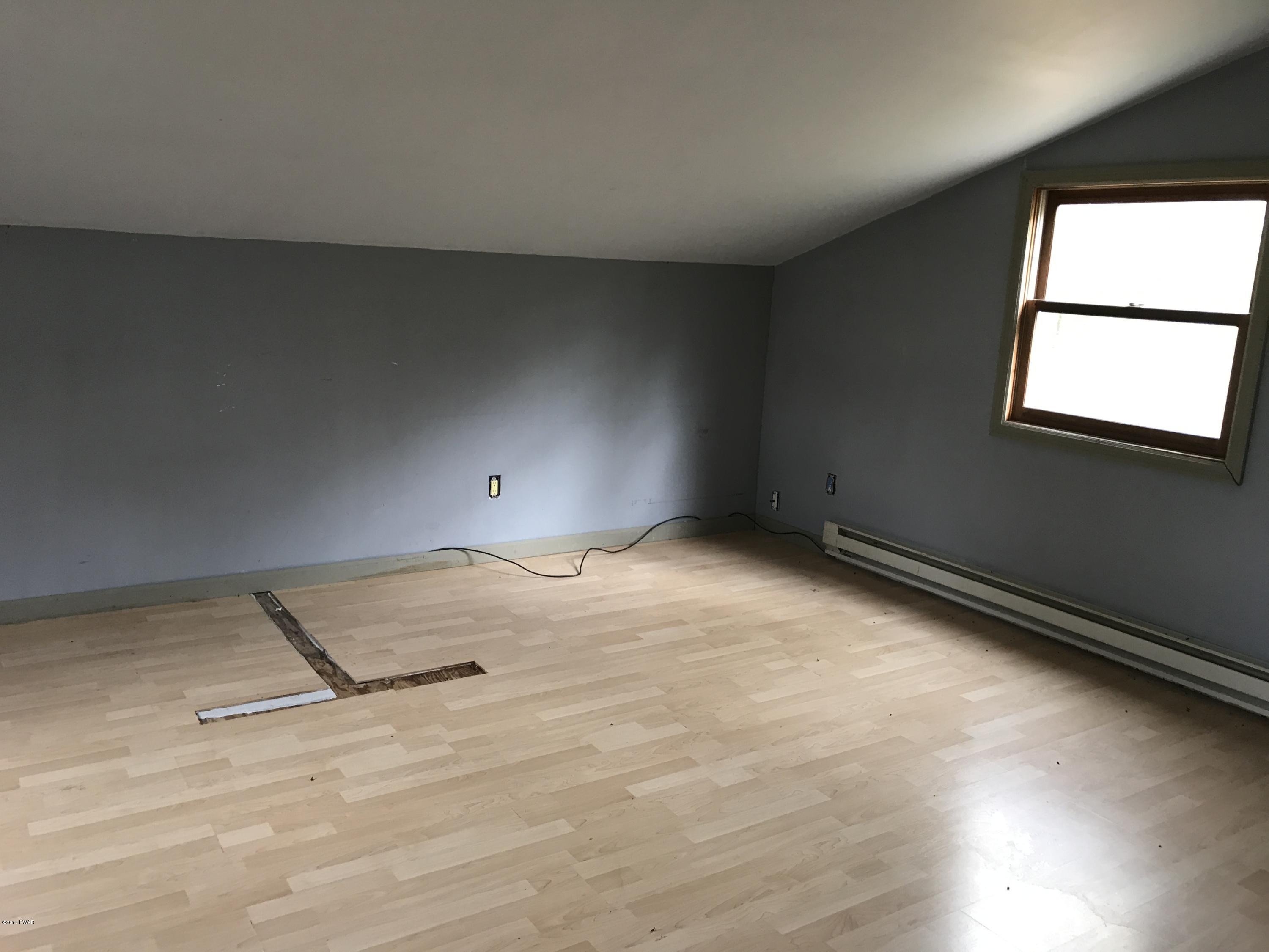 146 Weasel Road Dingmans Ferry, PA 18328 - Photo 7 of 15 a view of an empty room and window