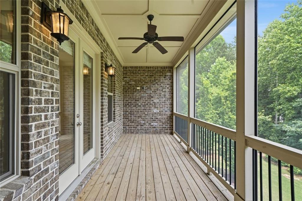 337 Rosshandler Road Suwanee, GA 30024 - Photo 19 of 45 a view of a porch with wooden floor and city view