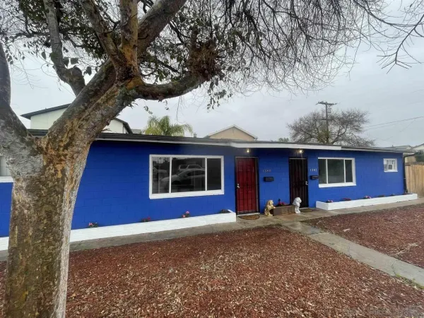 a house with trees in the background