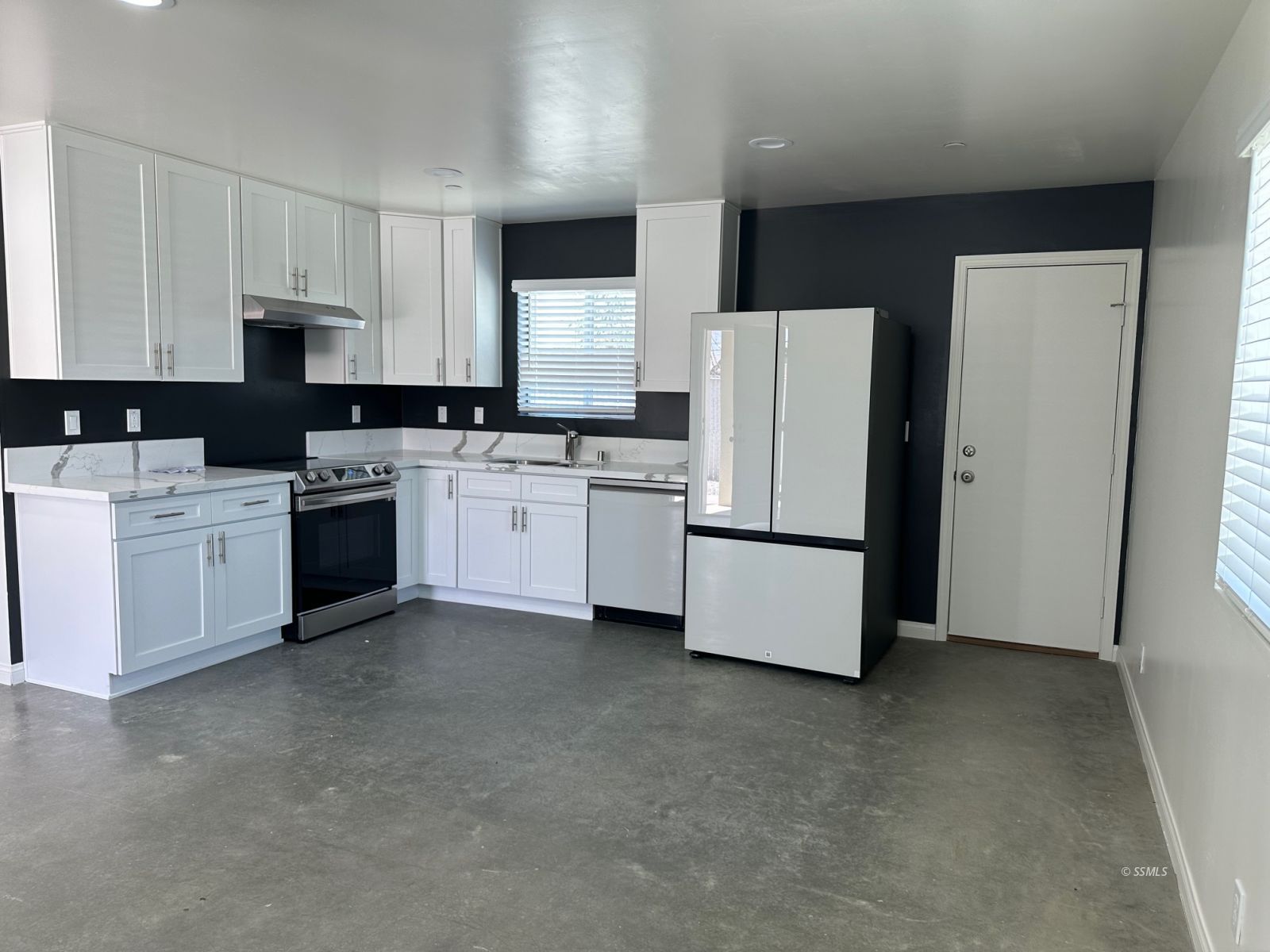 223 West Haloid Avenue Ridgecrest, CA 93555 - Photo 3 of 9 a kitchen with refrigerator and cabinets