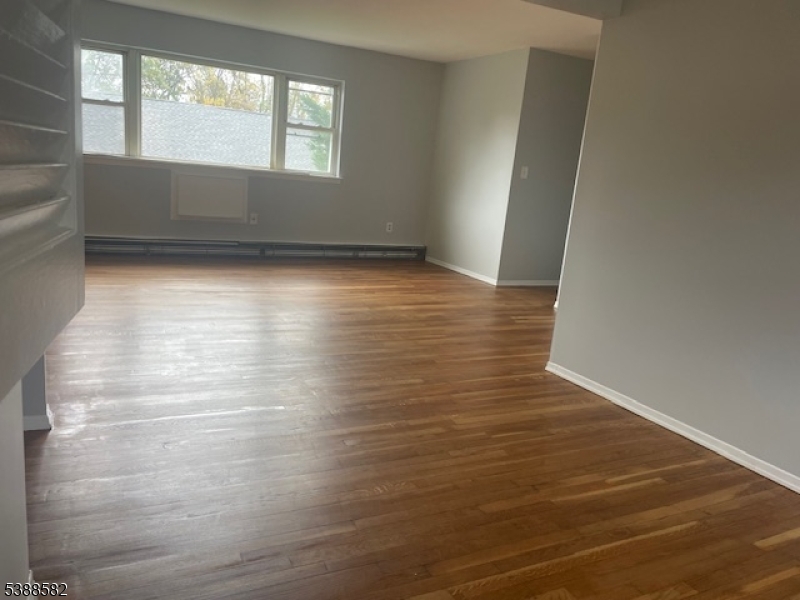 2467 Highway 10 Morris Plains, NJ 07950 - Photo 11 of 11 an empty room with wooden floor and windows