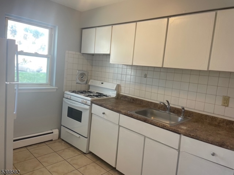 2467 Highway 10 Morris Plains, NJ 07950 - Photo 3 of 11 a kitchen with a sink and cabinets
