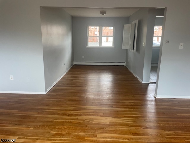 2467 Highway 10 Morris Plains, NJ 07950 - Photo 10 of 11 an empty room with wooden floor and windows