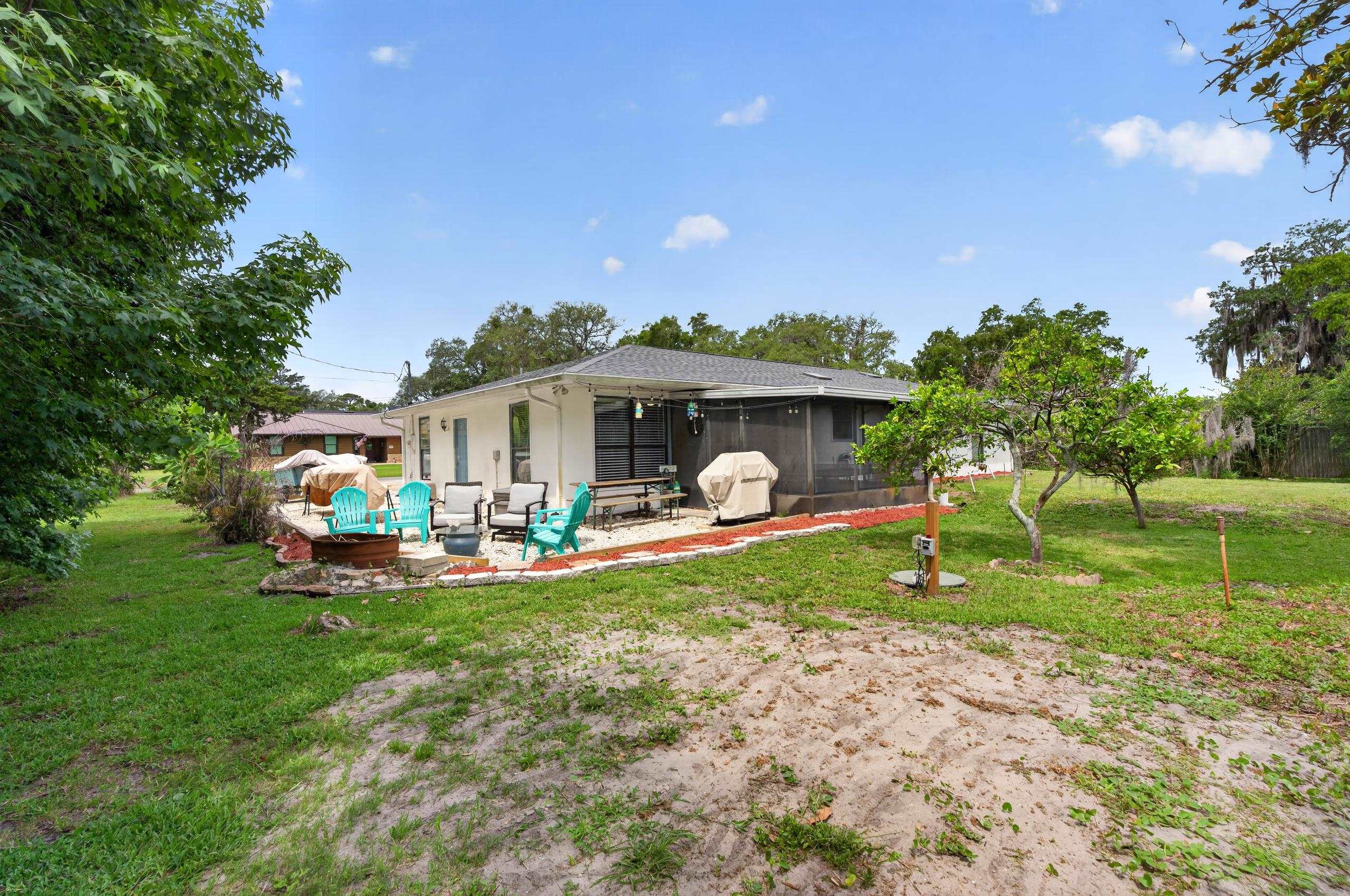 111 Pompano Road St. Augustine, FL 32086 - Photo 34 of 61 a view of a house with backyard and porch