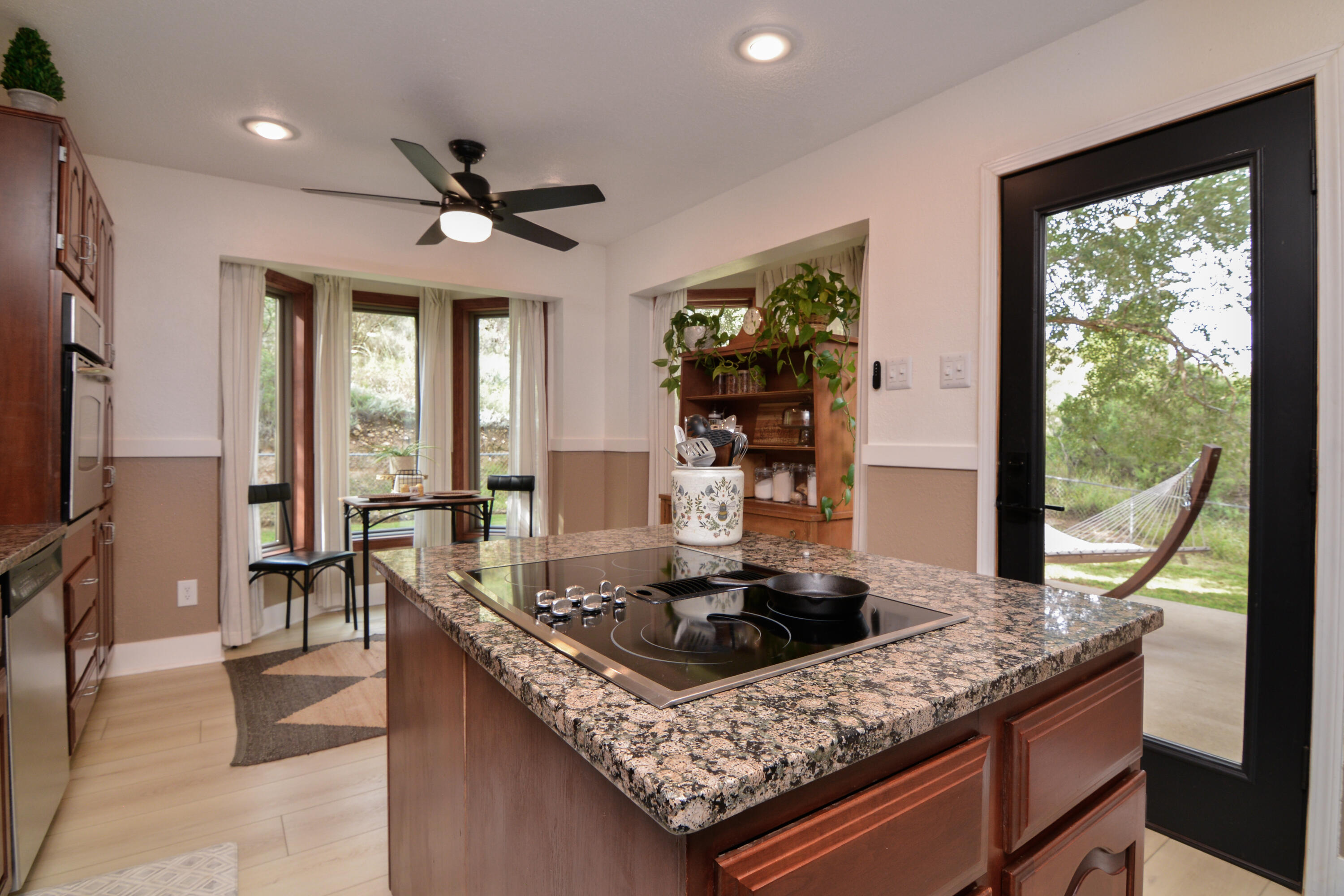 69 South Lake Shore Drive Ransom Canyon, TX 79366 - Photo 18 of 49 a kitchen with granite countertop a sink a counter top space appliances and cabinets