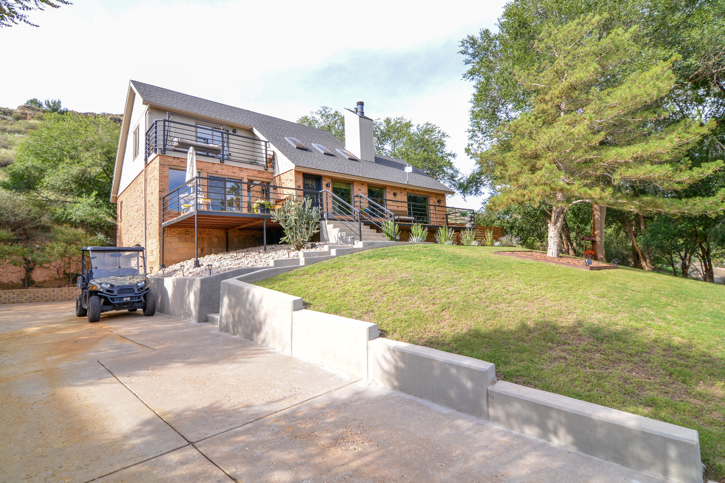 69 South Lake Shore Drive Ransom Canyon, TX 79366 - Photo 2 of 49 a view of a house with a yard and sitting area