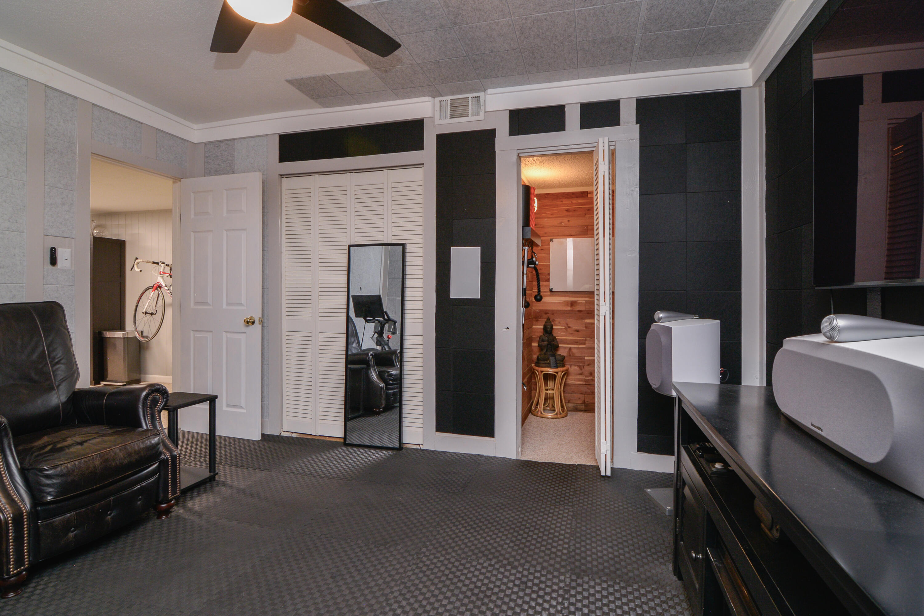 69 South Lake Shore Drive Ransom Canyon, TX 79366 - Photo 32 of 49 a hallway with furniture and a lamp