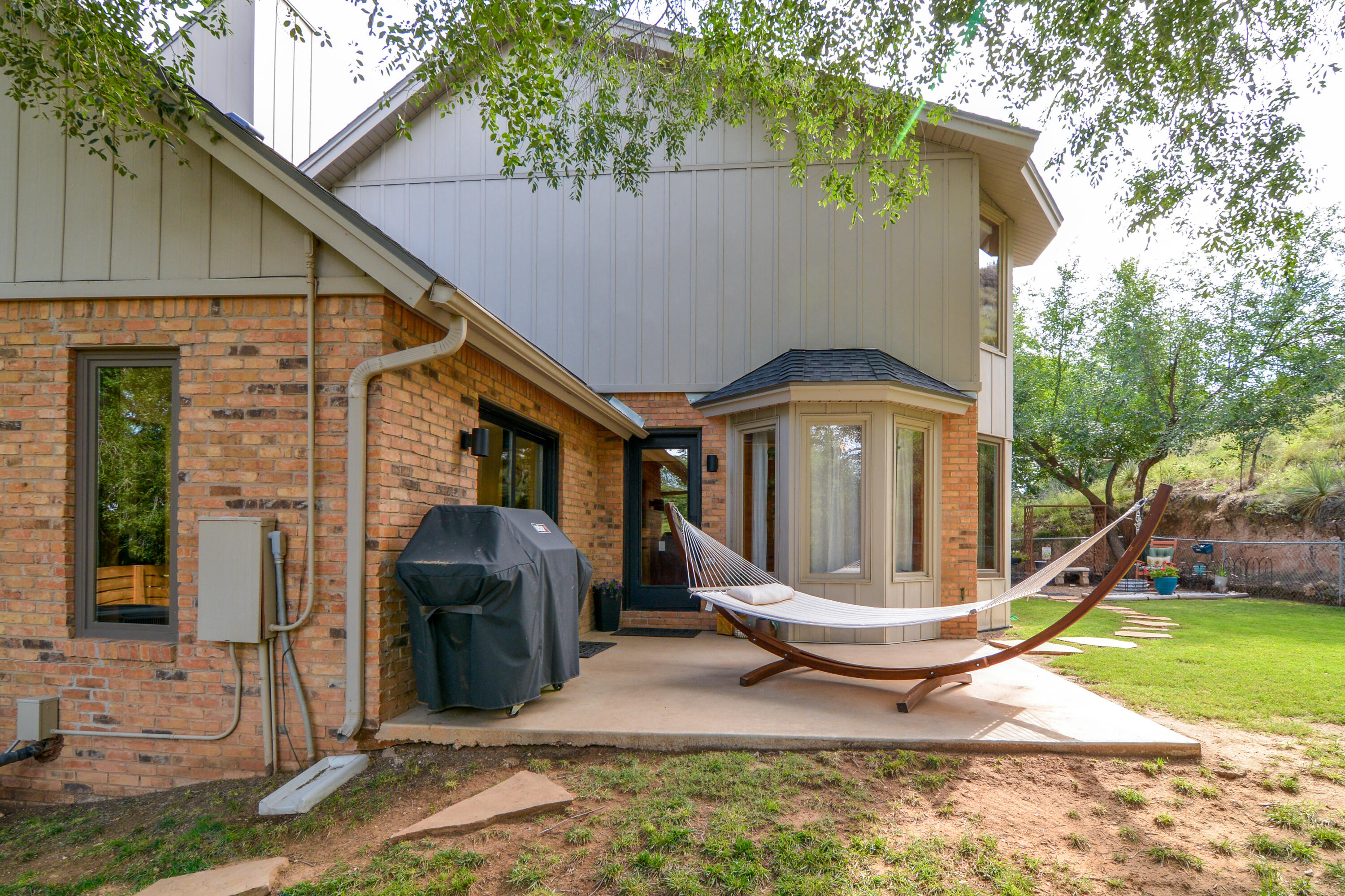 69 South Lake Shore Drive Ransom Canyon, TX 79366 - Photo 44 of 49 a view of a house with backyard and sitting area